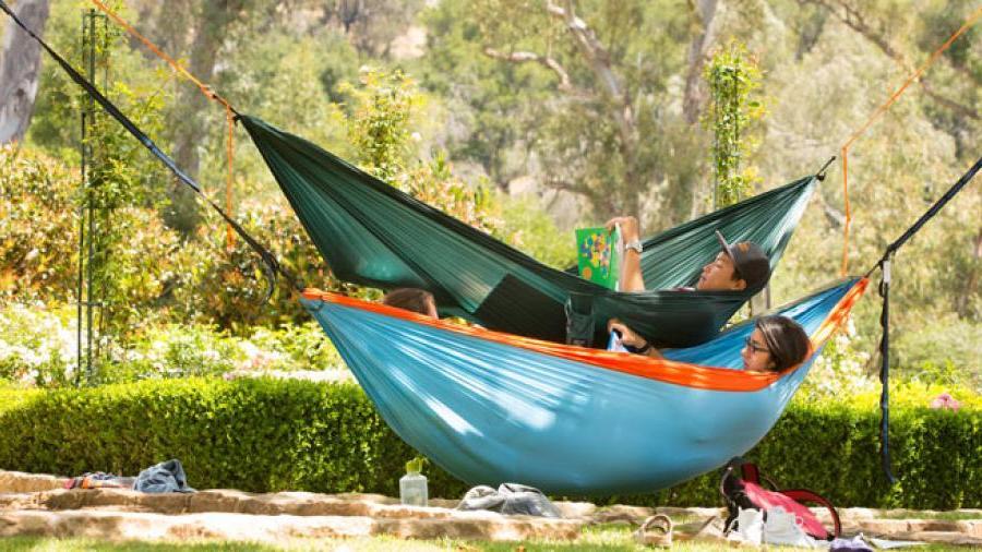 Student hammocking on campus